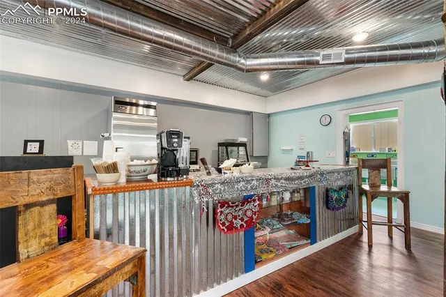 a living room filled with furniture and a fireplace