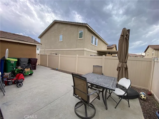 a view of backyard with seating space and furniture