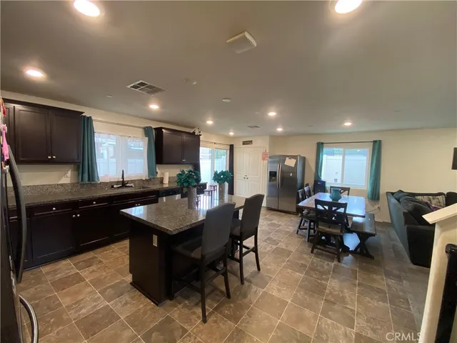 a kitchen with a dining table and chairs