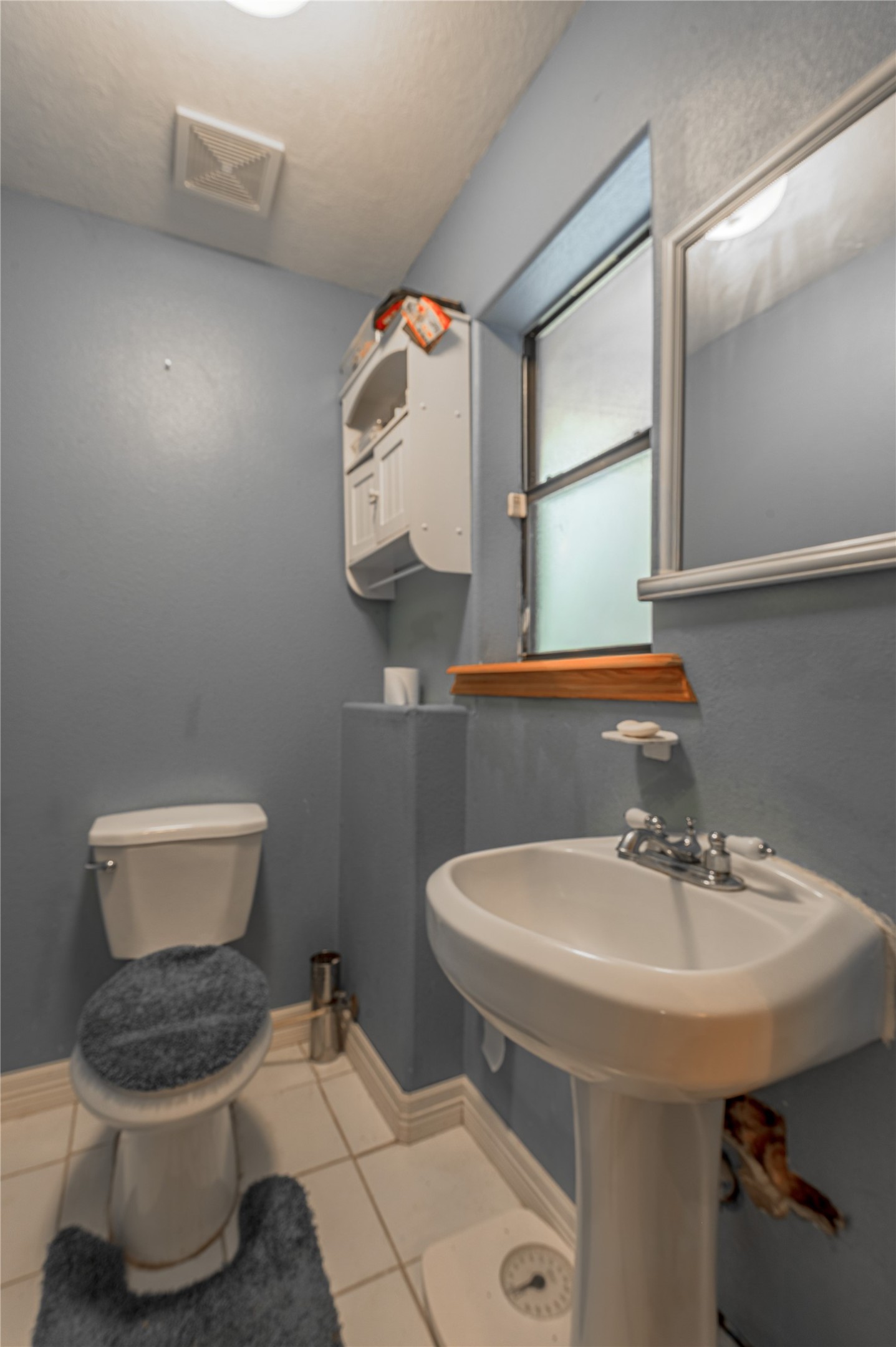 47-57 Stage Coach Road Coldspring, TX 77331 - Photo 26 of 50 a bathroom with a toilet sink and mirror