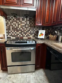a kitchen with a stove and a sink