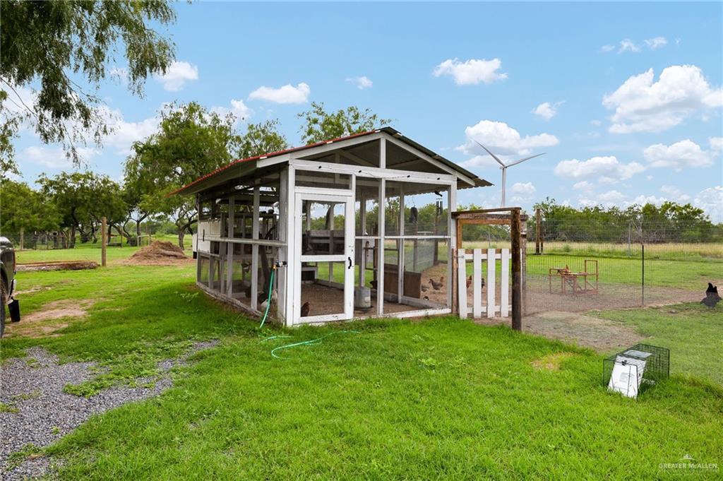 22172 North Olmito Road Rio Hondo, TX 78583 - Photo 28 of 33 a view of a house with yard and porch