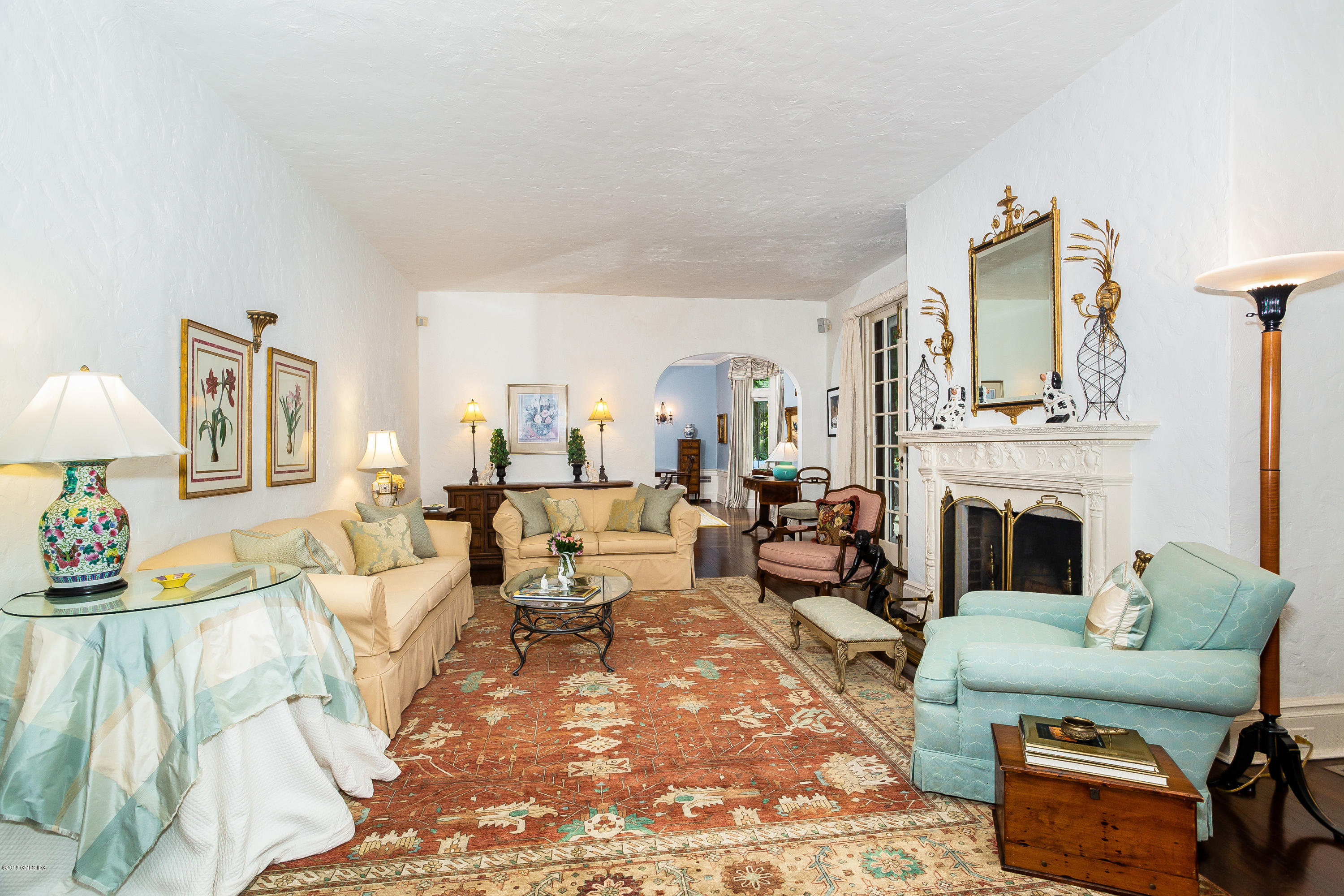 293 Shore Road Greenwich, CT 06830 - Photo 7 of 31 a living room with furniture fireplace and lamp
