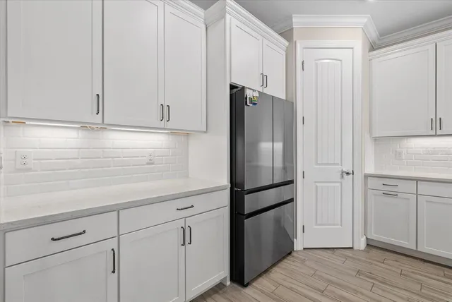 a dining room with furniture and a chandelier