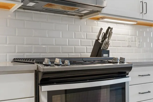 a bedroom with a bed next to a window