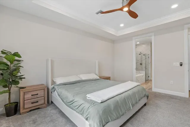 a bedroom with a couch and a window