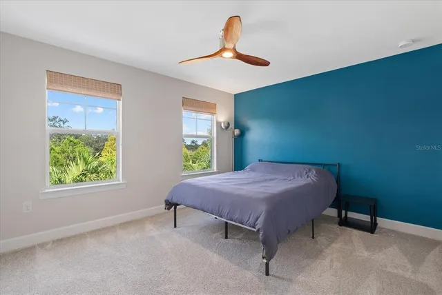 a view of a lake with houses in the back