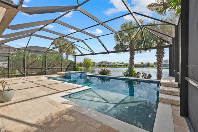 a view of a patio with dining table and chairs with a fire pit