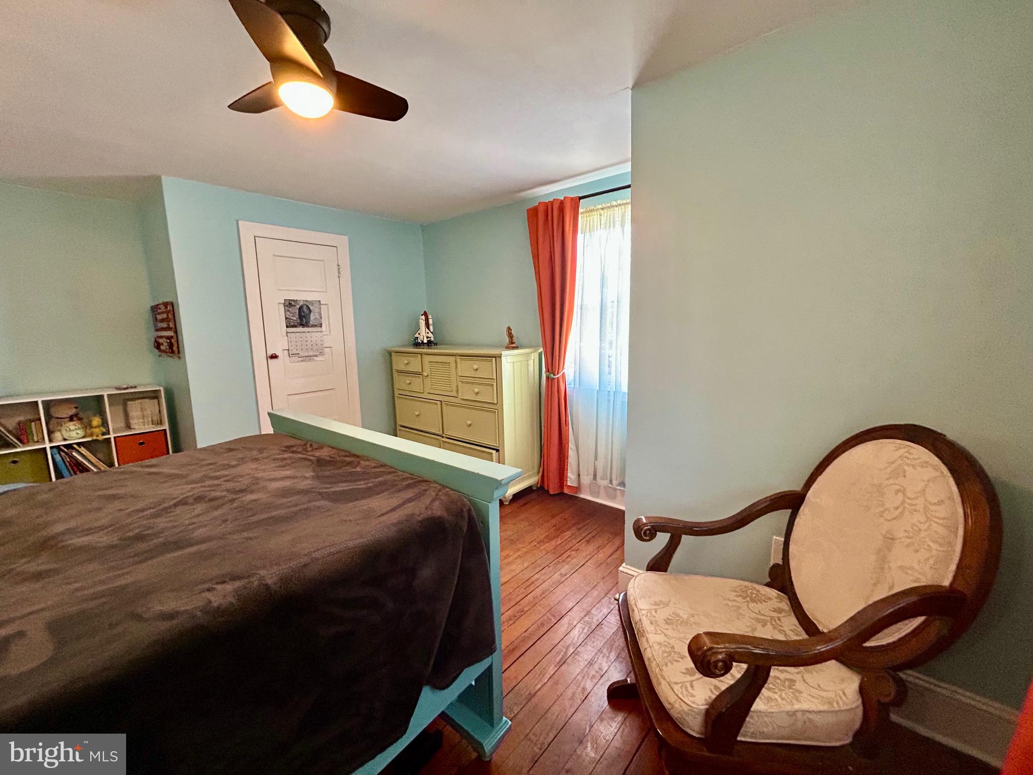 2415 Second Street Pike Newtown, PA 18940 - Photo 32 of 51 a bedroom with a bed and a chandelier