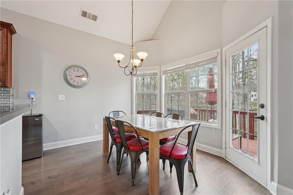 1330 Primrose Park Road Sugar Hill, GA 30518 - Photo 13 of 76 a view of a dining room with furniture window and wooden floor