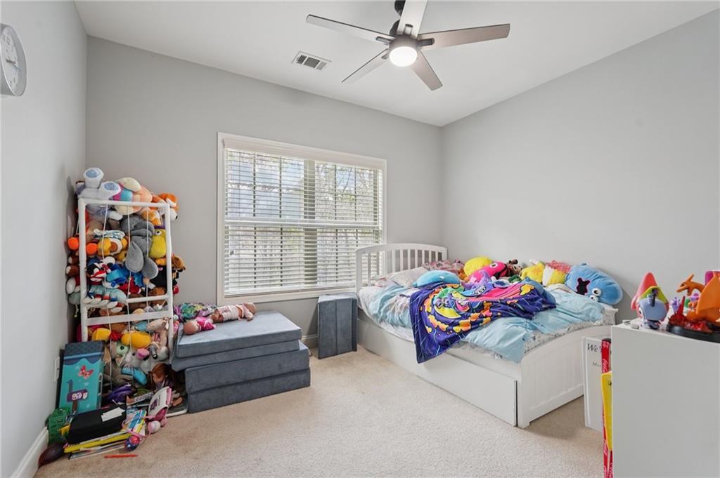 1330 Primrose Park Road Sugar Hill, GA 30518 - Photo 23 of 76 a bedroom with furniture a bed and a window