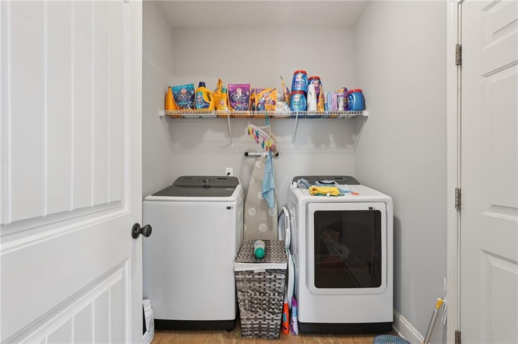 1330 Primrose Park Road Sugar Hill, GA 30518 - Photo 37 of 76 a utility room with dryer and washer