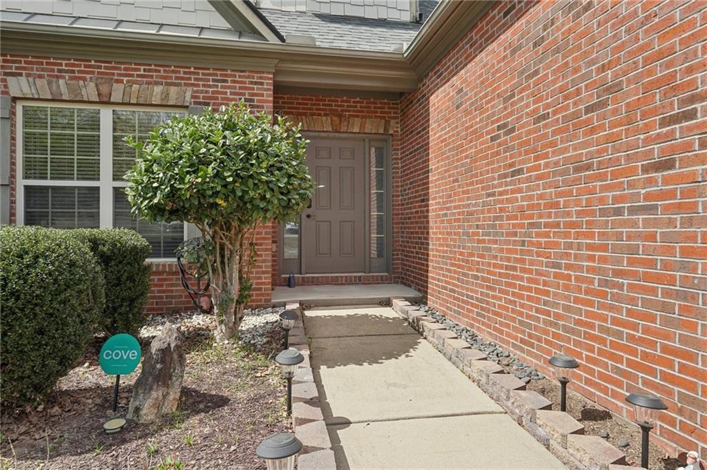 1330 Primrose Park Road Sugar Hill, GA 30518 - Photo 4 of 76 a potted plant sitting in front of a door