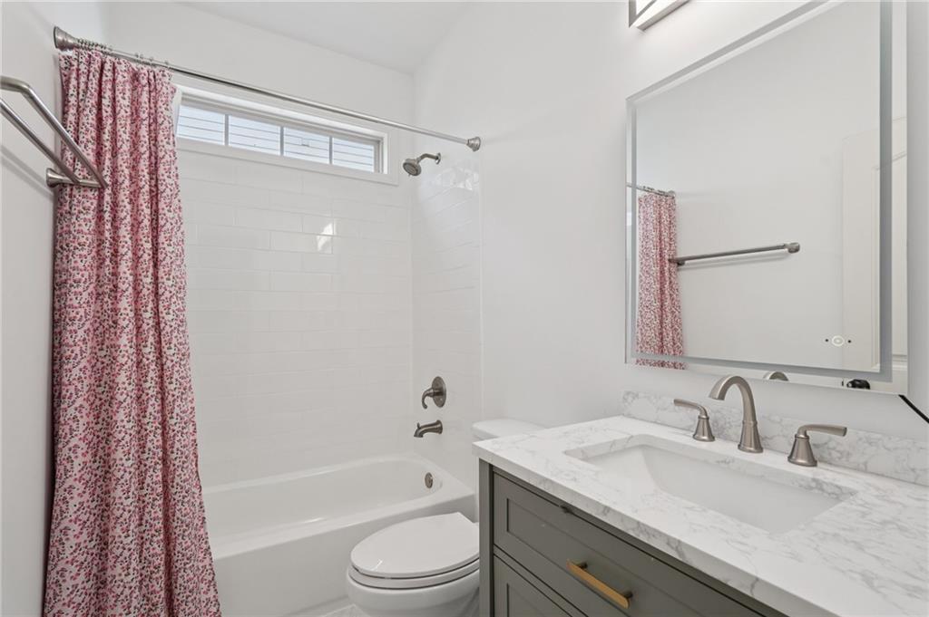 1330 Primrose Park Road Sugar Hill, GA 30518 - Photo 42 of 76 a bathroom with a granite countertop sink toilet and shower