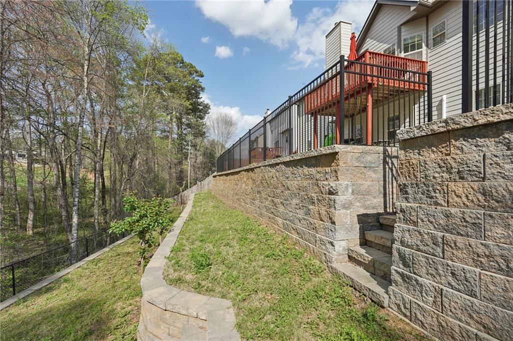 1330 Primrose Park Road Sugar Hill, GA 30518 - Photo 52 of 76 a view of a house with a yard