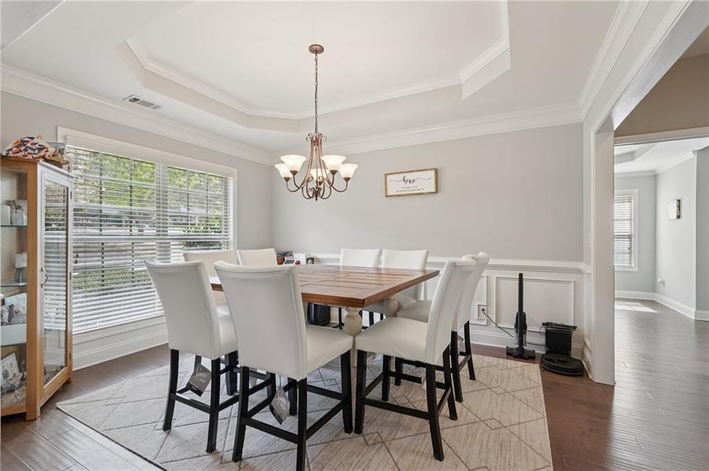 1330 Primrose Park Road Sugar Hill, GA 30518 - Photo 10 of 76 a view of a dining room with furniture window and wooden floor