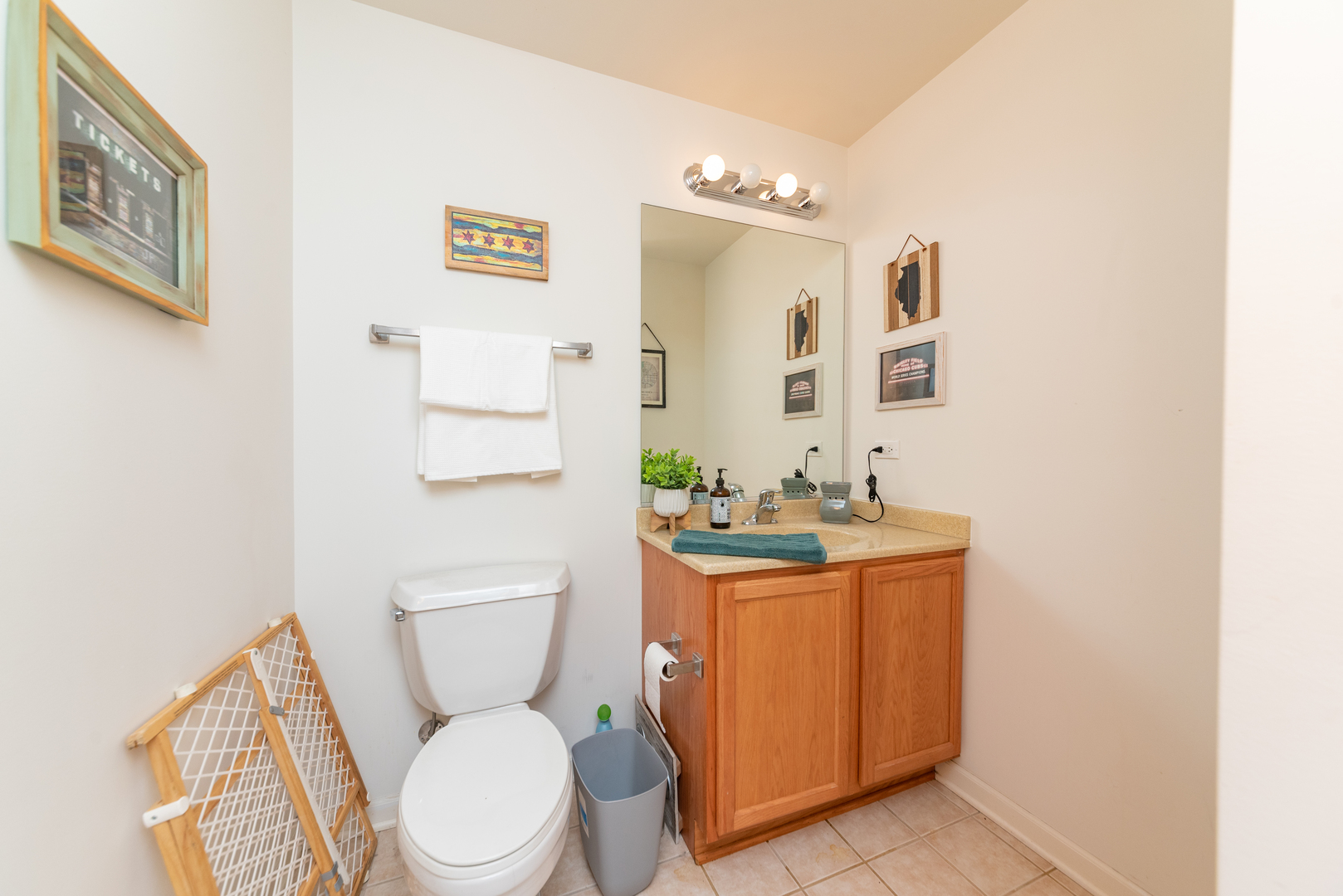 1250 South Indiana Avenue, Unit 812 Chicago, IL 60605 - Photo 12 of 23 a bathroom with a toilet a sink and mirror