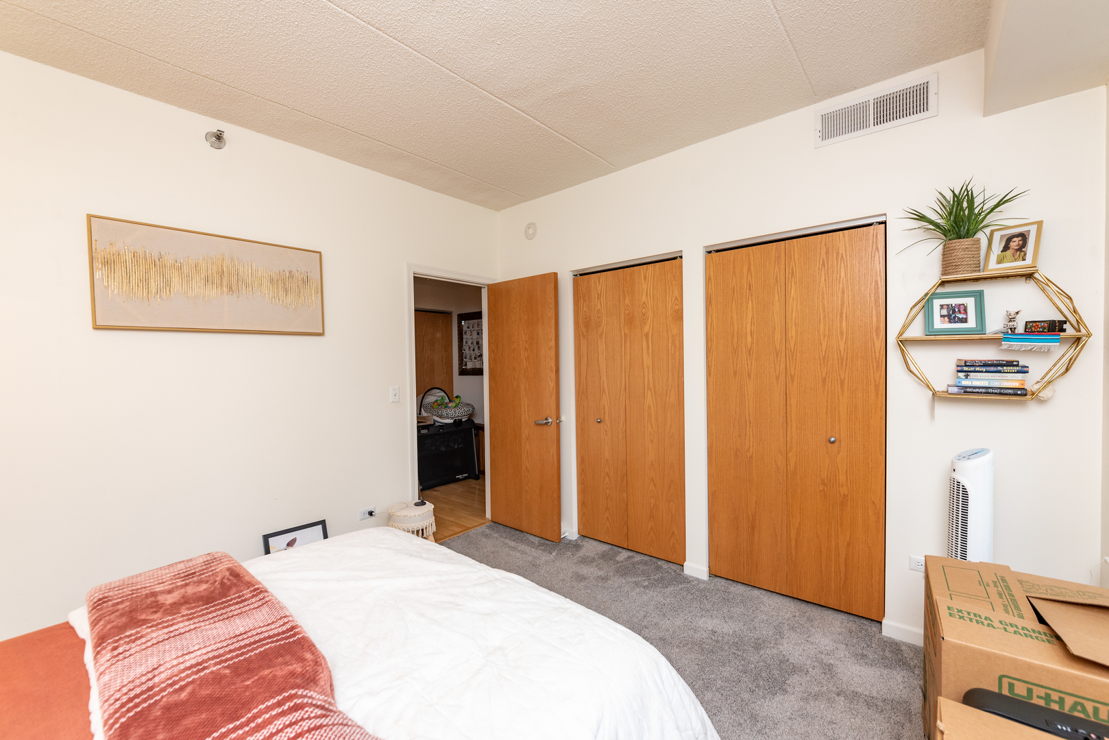 1250 South Indiana Avenue, Unit 812 Chicago, IL 60605 - Photo 8 of 23 a bedroom with a bed and furniture