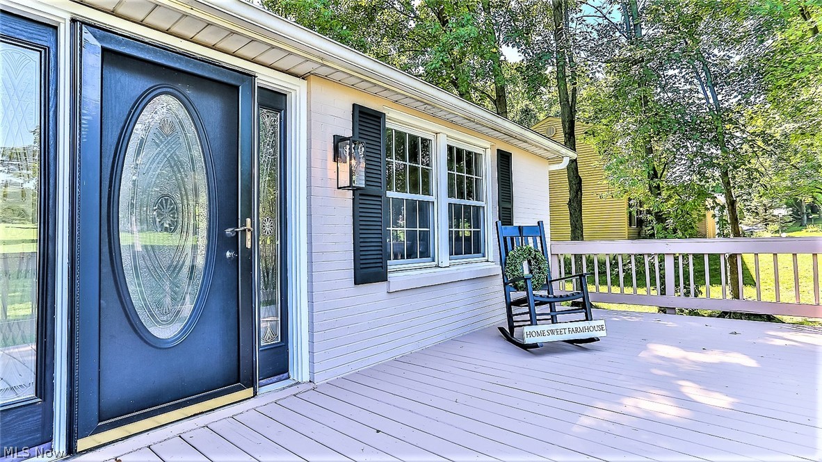 6141 Kungle Road New Franklin, OH 44216 - Photo 30 of 31 *FRONT DECK W/RAILINGS TO SIT OUT ON AND ENJOY YOUR BEAUTIFUL NEW HOME! BLACK DOOR WITH LEADED GLASS AND SIDELIGHTS W/MATCHING SHUTTERS AND NEW EXTERIOR LIGHT
