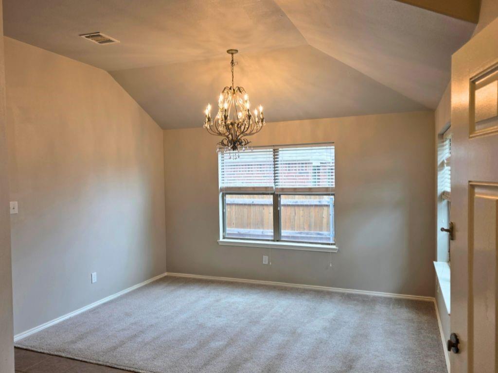 6320 Spring Ranch Drive Fort Worth, TX 76179 - Photo 3 of 24 Vaulted ceiling room featuring a multi-bulb chandelier, neutral tone carpet, and a large window with blinds