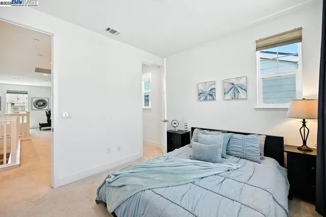 a bathroom with a sink toilet a mirror and shower