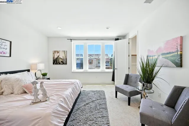 a large bathroom with a double vanity sink a large mirror and a shower