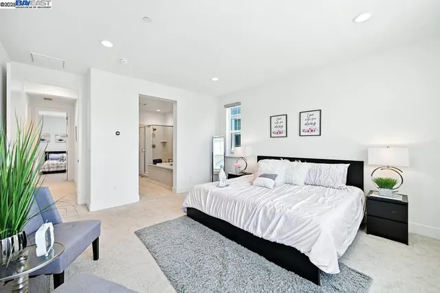 a bathroom with a double vanity sink a large mirror shower and bathtub