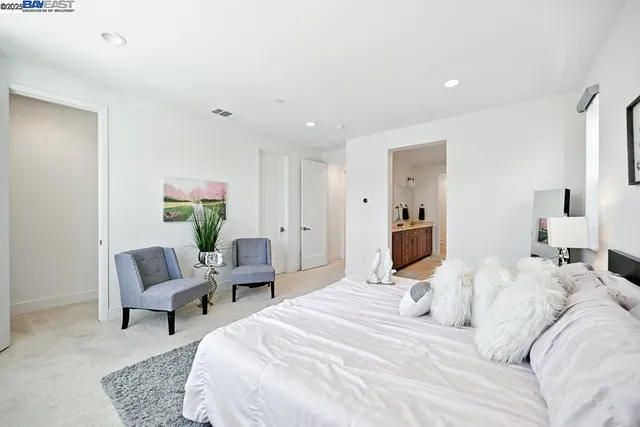 a bathroom with a sink vanity granite and a mirror