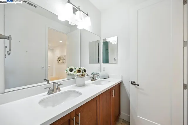 a view of a house with a small yard and wooden fence