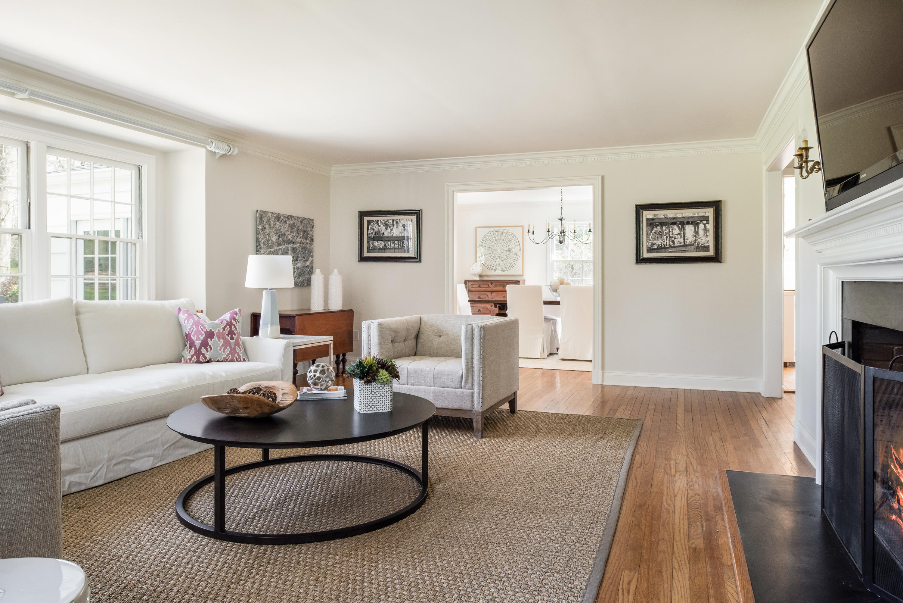 3 Haskell Lane Darien, CT 06820 - Photo 2 of 21 a living room with furniture a flat screen tv and a table