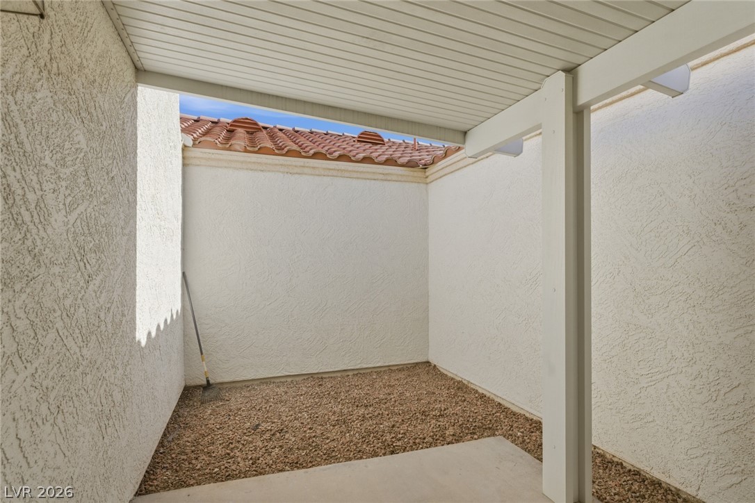 5449 Bugle Way, Unit 104 Las Vegas, NV 89108 - Photo 29 of 33 patio 2- This private outdoor space offers a covered patio and direct access indoors.