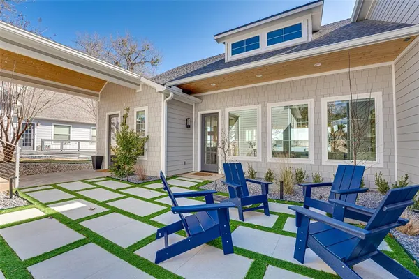 a outdoor space with patio the couches and a dining table with garden view
