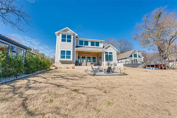 a front view of a house with yard and porch