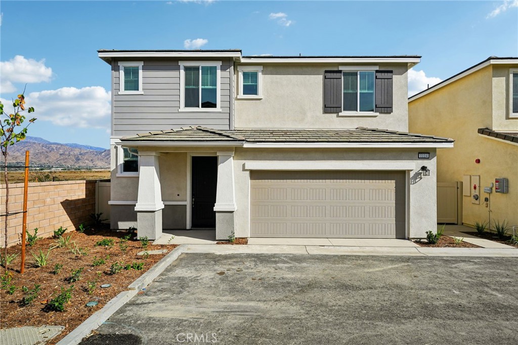 a view of a house with wooden roof and a fireplace