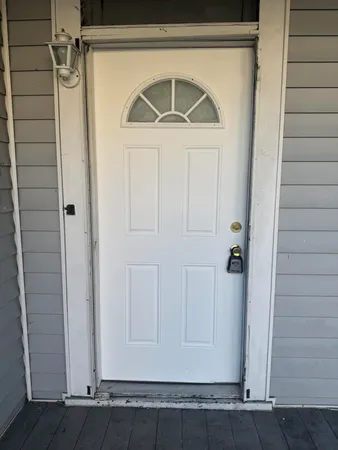 a view of entryway with wooden floor