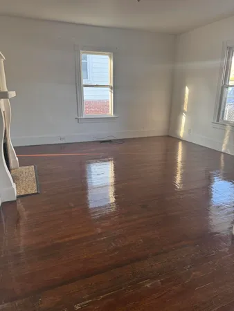 a view of a livingroom with wooden floor