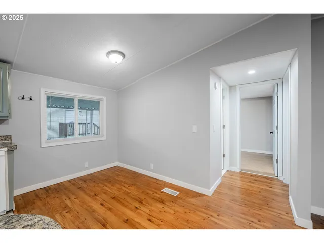 a view of an empty room and window