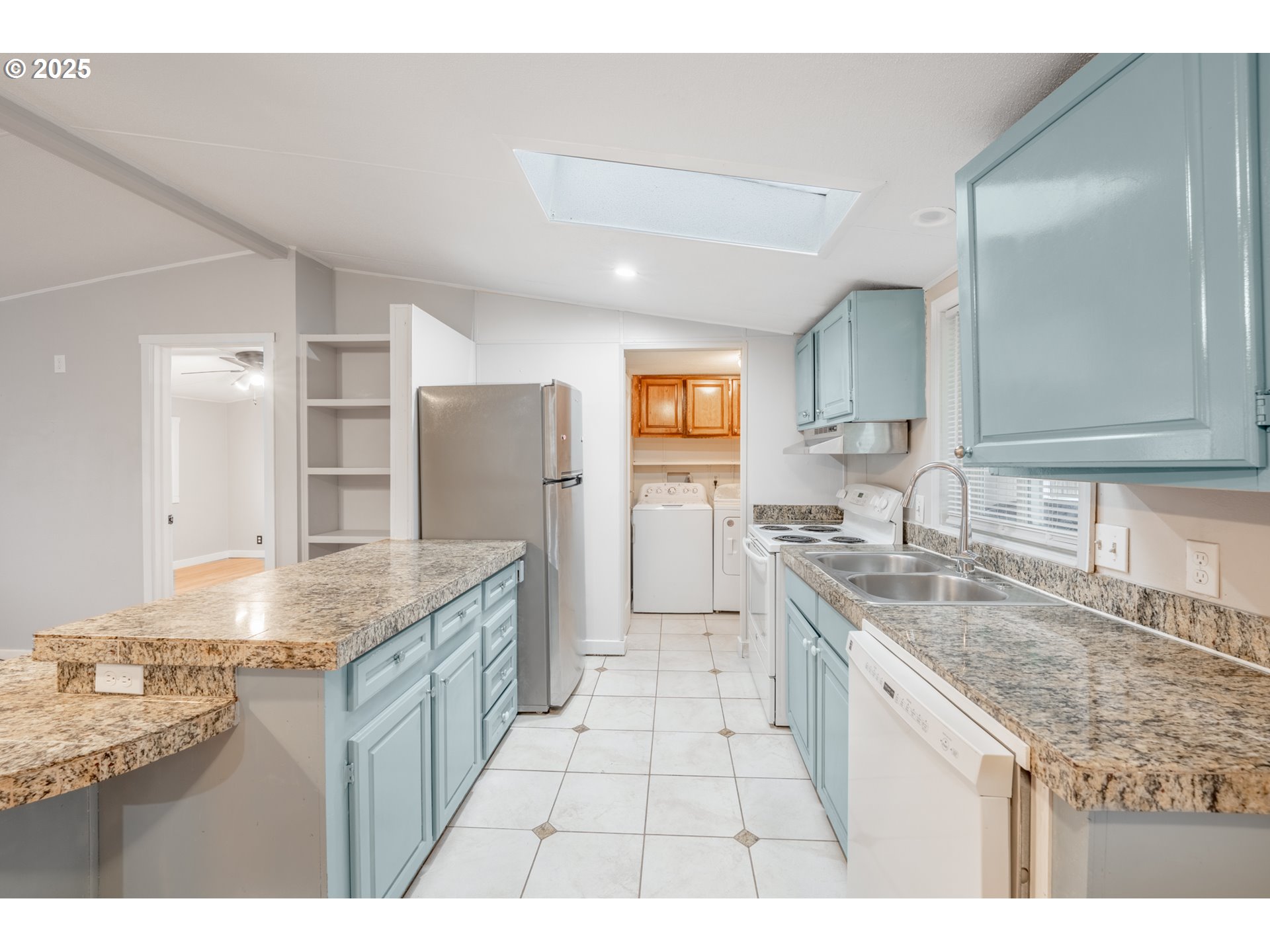 428 Southwest Boston Way, Unit 73 Beaverton, OR 97006 - Photo 10 of 25 a kitchen with granite countertop a sink and cabinets