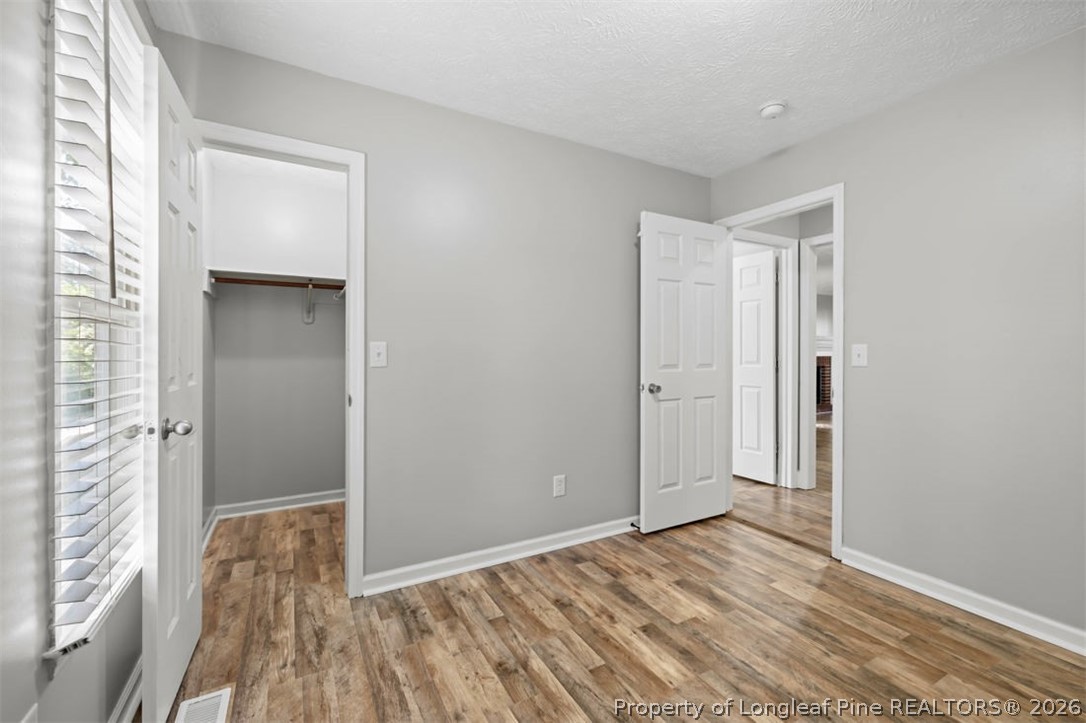 1205 Crossbend Court Fayetteville, NC 28314 - Photo 26 of 37 a view of a room with wooden floor and a window