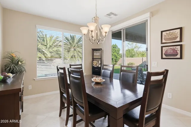 a living room with furniture kitchen view and a fireplace