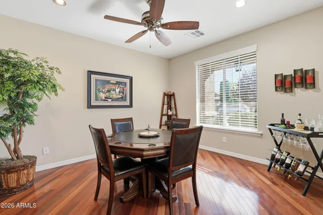 a spacious bedroom with a balcony a bed and a flat screen tv