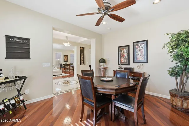 a spacious bedroom with a bed and a flat screen tv