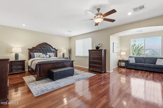 a spacious bathroom with a tub sink and mirror