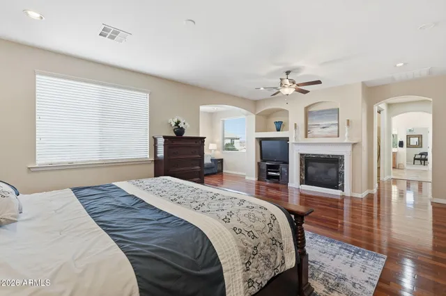 a room with a refrigerator and mirror