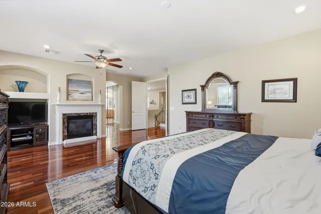 a spacious bathroom with a tub sink double vanity granite and a bathtub