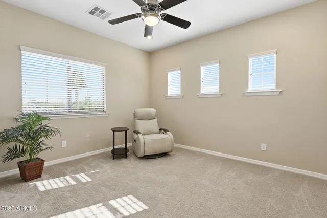 a view of a patio with table and chairs potted plants with swimming pool