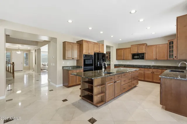 a kitchen with granite countertop a sink and counter space
