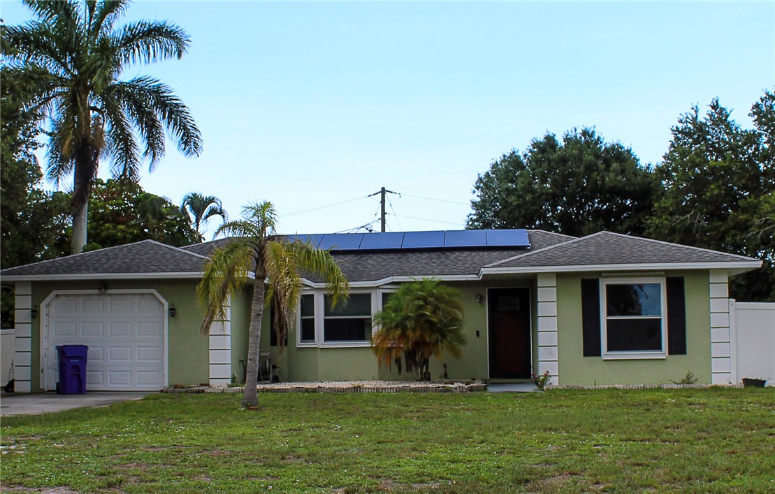 102 Cardinal Drive Sebastian, FL 32958 - Photo 11 of 34 a front view of a house with a yard
