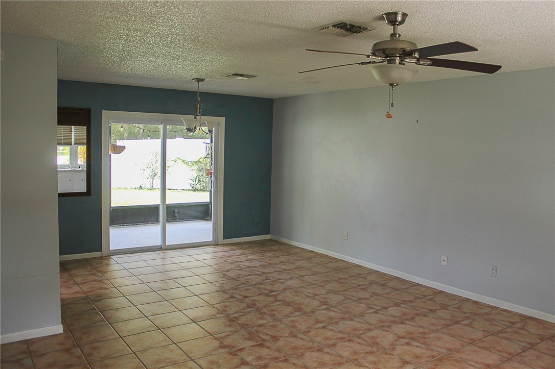 102 Cardinal Drive Sebastian, FL 32958 - Photo 16 of 34 en empty room with windows