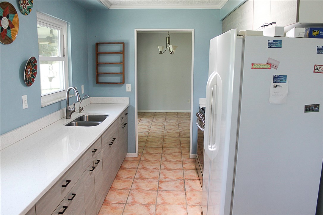 102 Cardinal Drive Sebastian, FL 32958 - Photo 17 of 34 a bathroom with a double vanity sink and a mirror